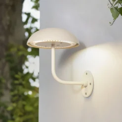 Arcchio LED-Akkutischleuchte Thenra, beige, Wandhalterung