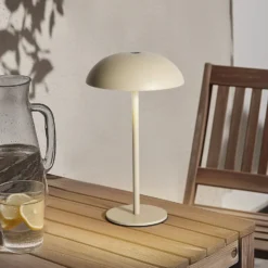 Arcchio LED-Akkutischleuchte Thenra, beige, Wandhalterung