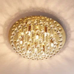 Lindby Deckenleuchte Gillion, 8-flg., gold, Kristall, Ø 55cm