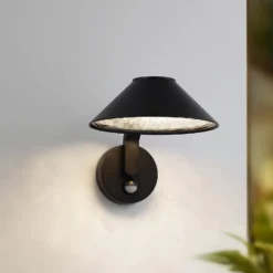 Lindby LED-Wandlampe Capelo, schwarz, Metall, Sensor, Ø20cm