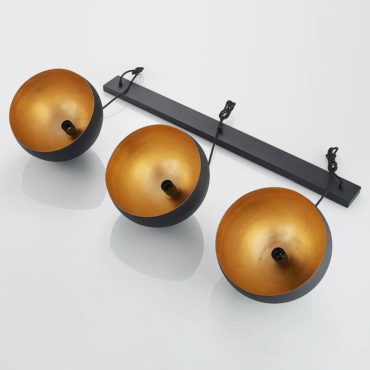 Lindby Pendellampe Tarjei, Länge 120cm, schwarz/gold, Metall