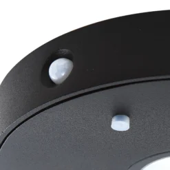Lucande LED-Solar-Wandlampe Tavon, rund, schwarz, Sensor