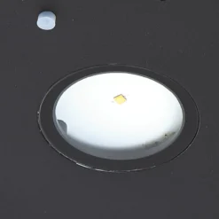 Lucande LED-Solar-Wandlampe Tavon, rund, schwarz, Sensor