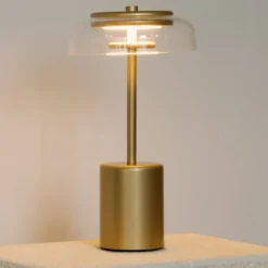 Nuura LED-Akku-Tischlampe Blossi, Höhe 26 cm goldfarben/klar