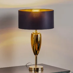 Tischlampe Show Ogiva, Textil, schwarz/goldfarben