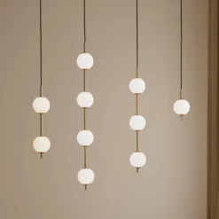 UMAGE LED-Hängeleuchte Audrey, messingfarben, 4-flg. Ø 12 cm